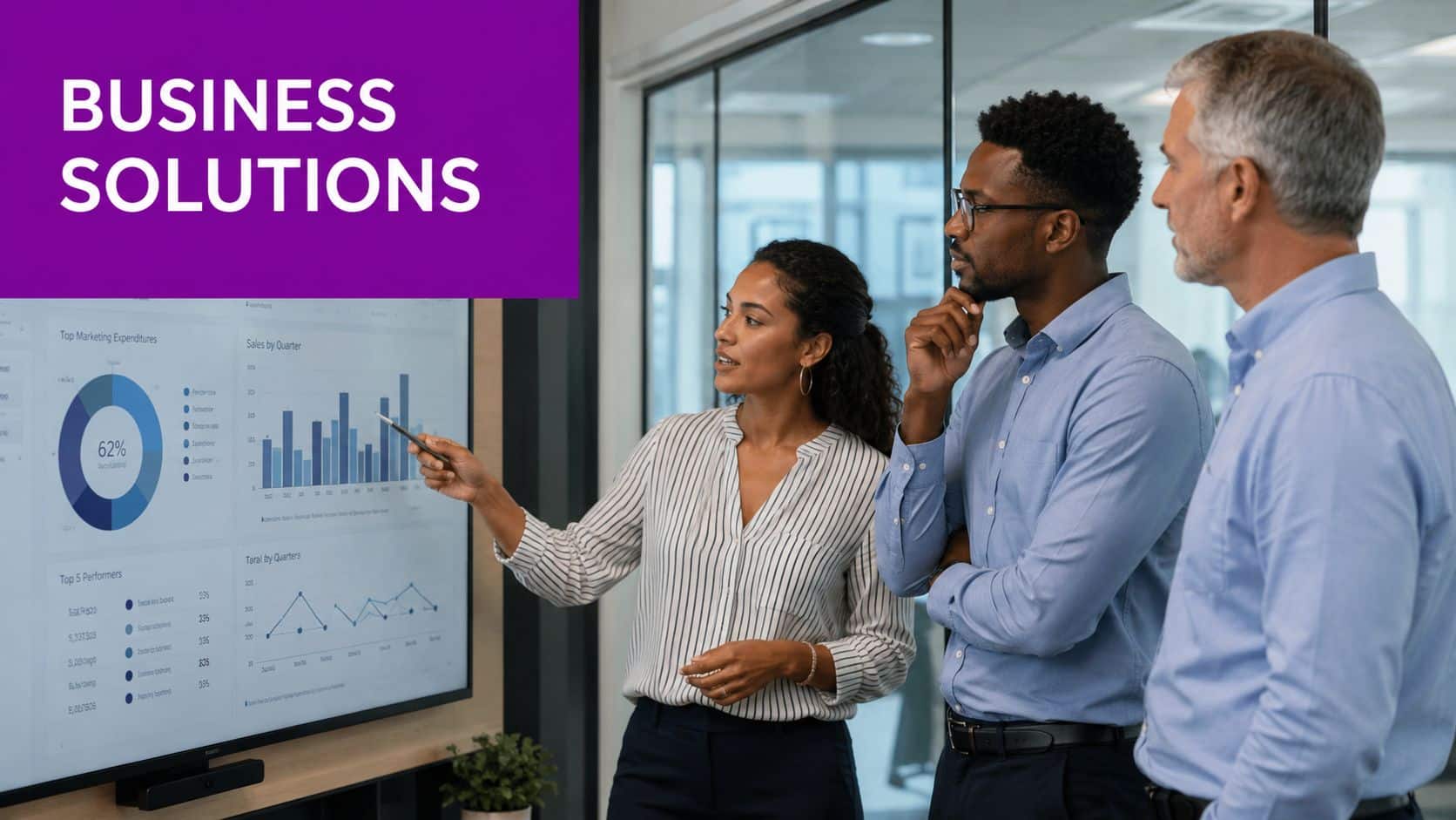 A professional team discussing business data analytics on a large presentation screen in a modern office.